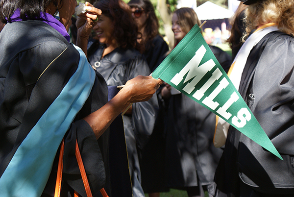 Students, alums and faculty wave green pendants to represent the Class of 2014. (All Photos by Melodie Miu)