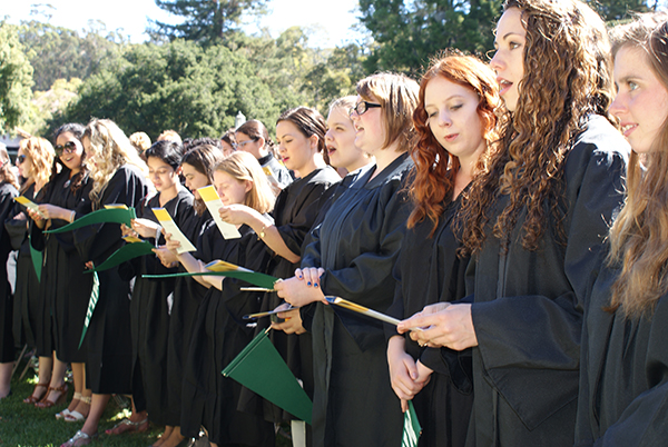 The Class of 2014 sings the Mills College Hymn, "Fires of Wisdom."