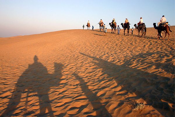 Camel-riding. (Wikimedia Commons)